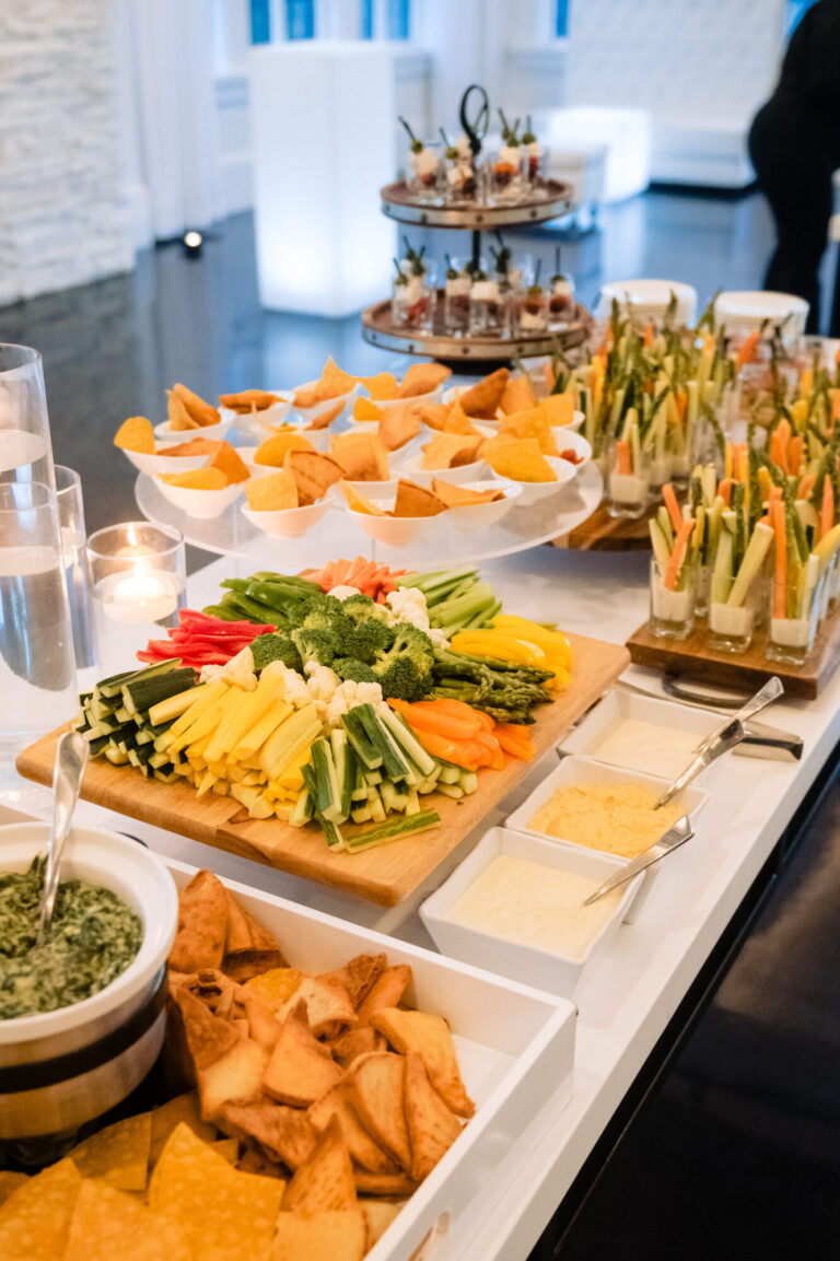 Elegant cocktail hour display at Lakeview Pavilion featuring gourmet hors d'oeuvres, fresh vegetable crudités, artisan cheeses, and chef-crafted appetizers for weddings and private events in Foxborough, Massachusetts.