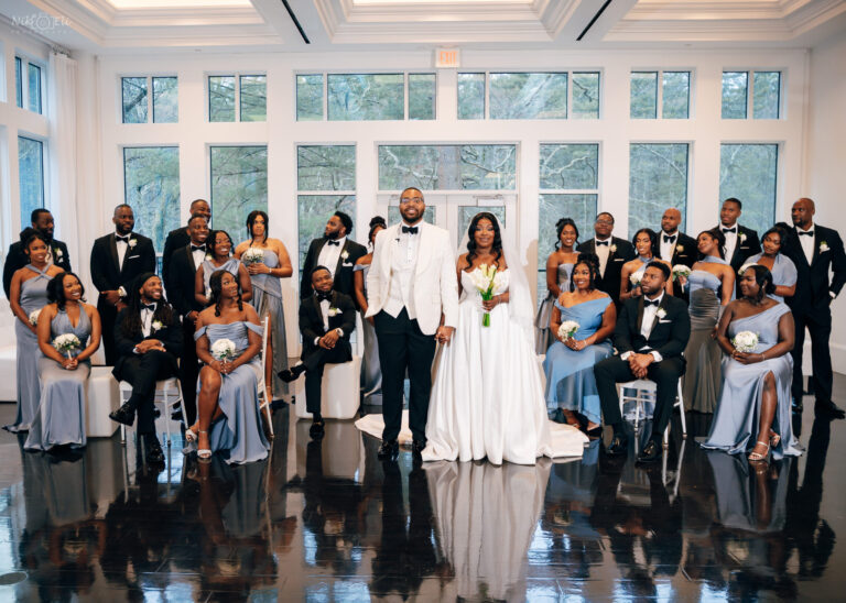 Wedding party portrait inside the Lakeside Ballroom at Lakeview Pavilion, a luxury wedding venue in Foxborough, Massachusetts, featuring the bride, groom, bridesmaids, and groomsmen.