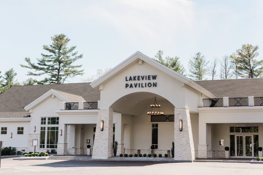 Front entrance of Lakeview Pavilion, a luxury waterfront wedding venue in Foxborough, Massachusetts, featuring elegant white architecture and modern design.