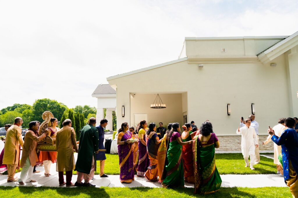 Guests celebrating a personalized outdoor wedding tradition on the grounds of Lakeview Pavilion in Foxborough, Massachusetts.