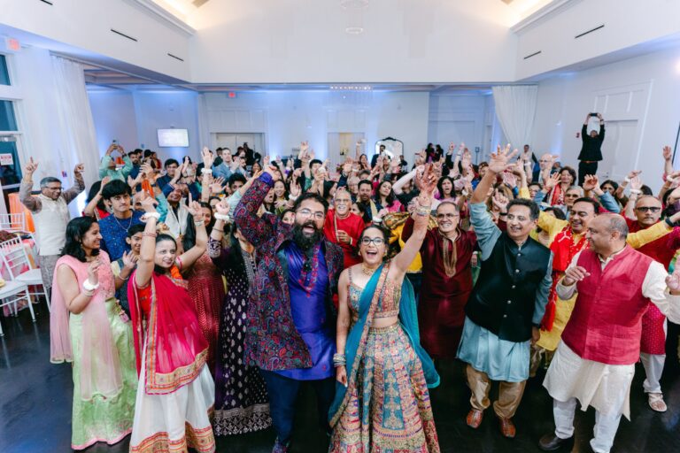 Guests celebrating together on the dance floor during a lively wedding reception at Lakeview Pavilion in Foxborough, Massachusetts.