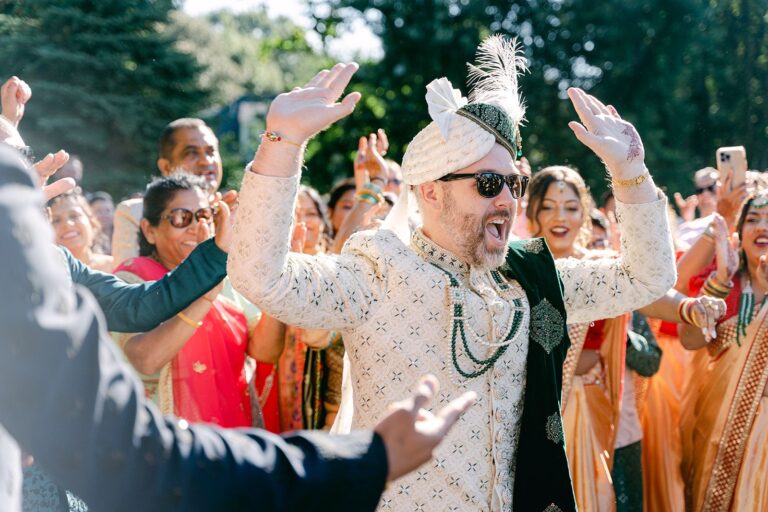 A groom celebrating with family and friends at Lakeview Pavilion in Foxborough, Massachusetts.