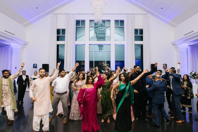 Guests celebrating together on the dance floor during a lively wedding reception in the Lakeview Ballroom at Lakeview Pavilion in Foxborough, Massachusetts.