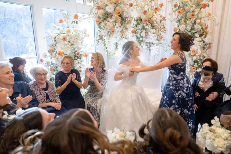 Bride surrounded by family and loved ones during the Bedeken ceremony at Lakeview Pavilion in Foxborough, Massachusetts.
