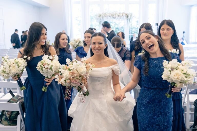 Bride celebrating with her bridesmaids in the Lakeside Ballroom at Lakeview Pavilion in Foxborough, Massachusetts.