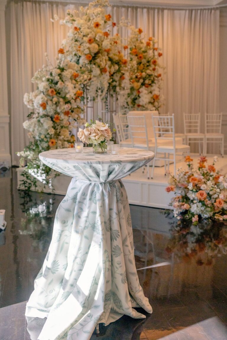 Elegant cocktail table with floral décor in the Lakeview Cocktail Space at Lakeview Pavilion in Foxborough, Massachusetts.
