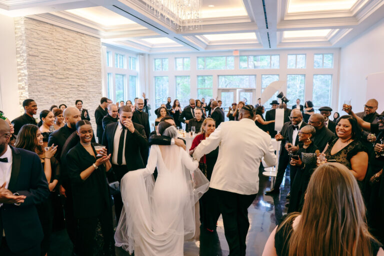 Guests celebrating on the dance floor during a wedding reception in the Lakeside Ballroom at Lakeview Pavilion in Foxborough, Massachusetts.